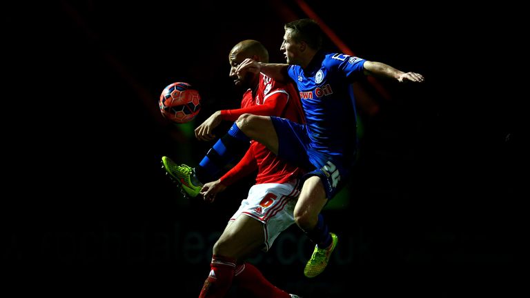 ROCHDALE, ENGLAND - JANUARY 03:  Jamie Allen of Rochdale battles for the ball with Kelvin wilson of Nottingham Forest during the FA Cup Third Round match b