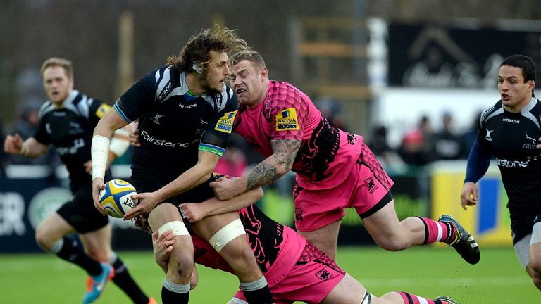 Josh Furno of Newcastle Falcons (L) challenged by Koree Britton (R) and Ben West of London Welsh 