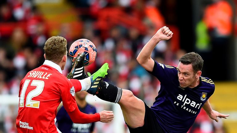 Kevin Nolan of West Ham battles for the ball with George Saville of Bristol City