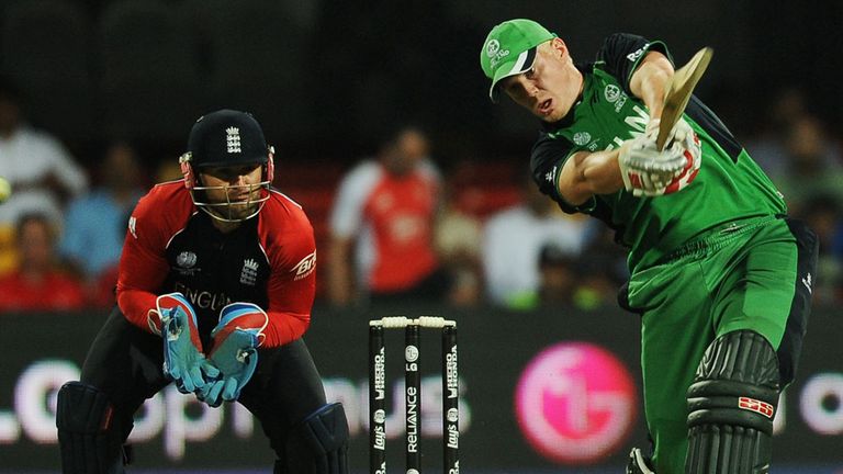 England's Matt Prior (L) watches as Ireland cricketer Kevin O'Brien (R) plays a shot during the ICC Cricket World cup match between England and Ireland