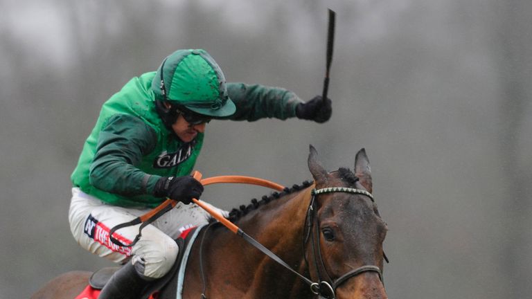 ESHER, ENGLAND - JANUARY 03:  Barry Geraghty riding L'Ami Serge clear the last to win The 32Red Tolworth Hurdle Race at Sandown racecourse.