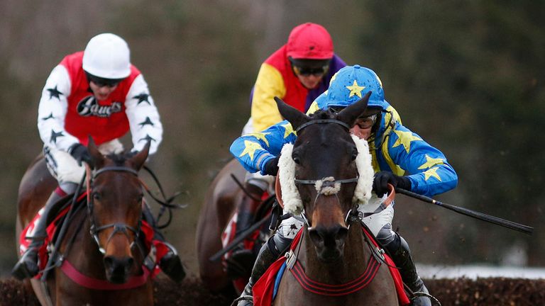 ESHER, ENGLAND - JANUARY 31:  Daryl Jacob ridng Le Reve clear the last to win The Betred Masters Handicap Steeple Chase at Sandown.