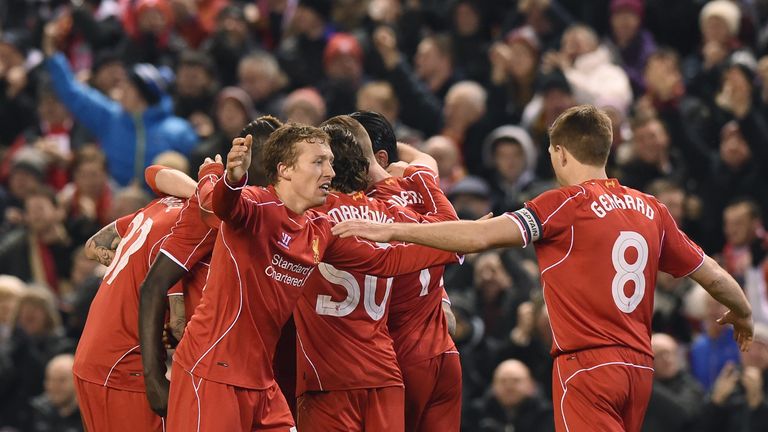 Liverpool players celebrate following Raheem Sterling's goal against Chelsea in the Capital One Cup semi-final first leg at Anfield