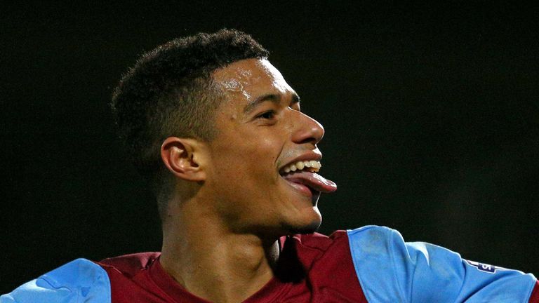 SCUNTHORPE, ENGLAND - JANUARY 06:  Lyle Taylor of Scunthorpe celebrates after scoring his team's second goal during the FA Cup Third Round match between Sc