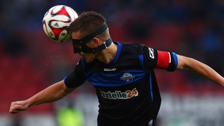 MAINZ, GERMANY - JANUARY 31: Uwe Huenemeier of Paderborn jumps for a header during the Bundesliga 