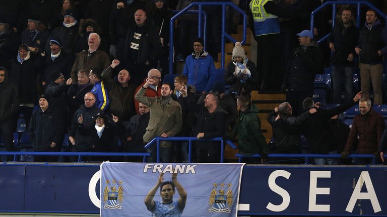 A banner shows Manchester City's English midfielder Frank Lampard who used to play for Chelsea between Chelsea and Manchester City