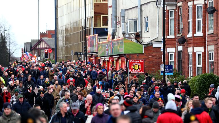 Fans walk towards Old Trafford ahead of the second Super Sunday match of the afternoon - Man Utd v Southampton.
