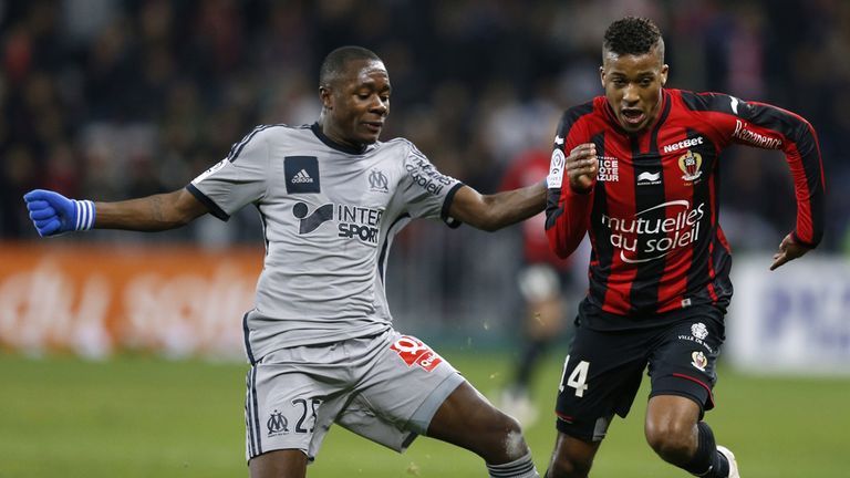 Marseille midfielder Giannelli Imbula (left) vies with Nice's Alassane Plea