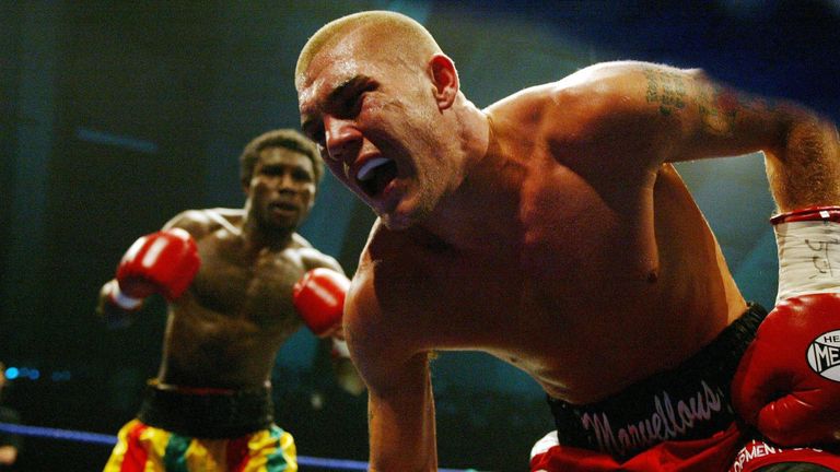 Jamie Moore is knocked down by Ossie Duran