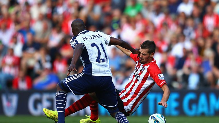 Morgan Schneiderlin of Southampton and Youssuf Mulumbu of West Brom battle for the ball during the Barclays Premier League match