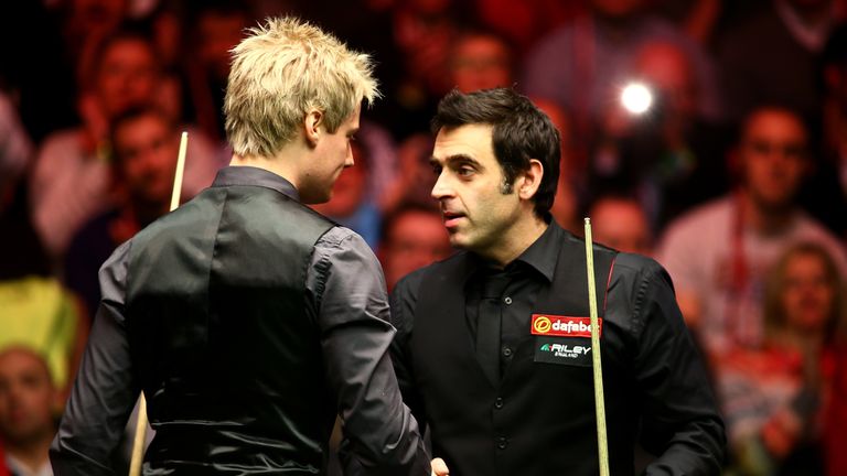 Neil Robertson shakes hands with Ronnie O'Sullivan after his 6-1 victory