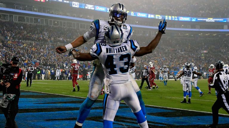 Cam Newton and Fozzy Whittaker of the Carolina Panthers celebrate during their NFC Wild Card Playoff game 