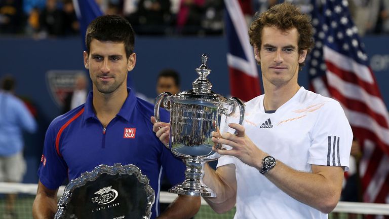 Andy Murray of Great Britain poses with the US Open championship trophy next to Novak Djokovic of Serbia after his victory in 2012