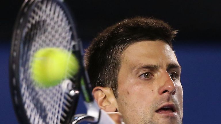 Novak Djokovic of Serbia plays a forehand in his semifinal match against Stanislas Wawrinka of Switzerland at the Australian Open