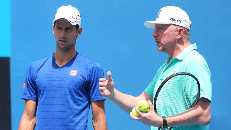 Novak Djokovic of Serbia and his coach Boris Becker of Germany talk tactics during a practice session during day three of the Australian Open