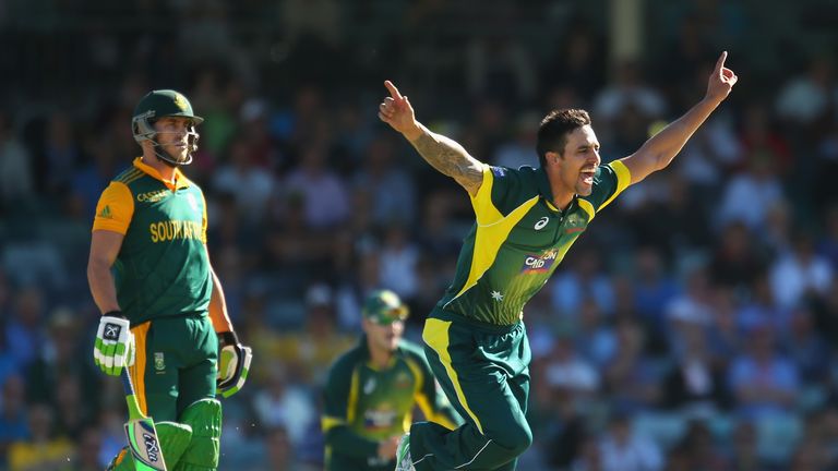 PERTH, AUSTRALIA - NOVEMBER 14:  Mitchell Johnson of Australia celebrates after dismissing Hashim Amla of South Africa as Faf du Plessis looks on during ga