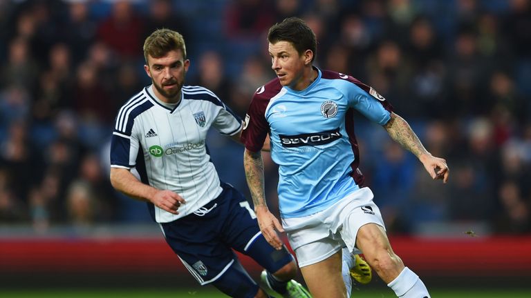 WEST BROMWICH, ENGLAND - JANUARY 03:  John Oster of Gateshead takes on James Morrison of West Bromwich Albion during the FA Cup Third Round match