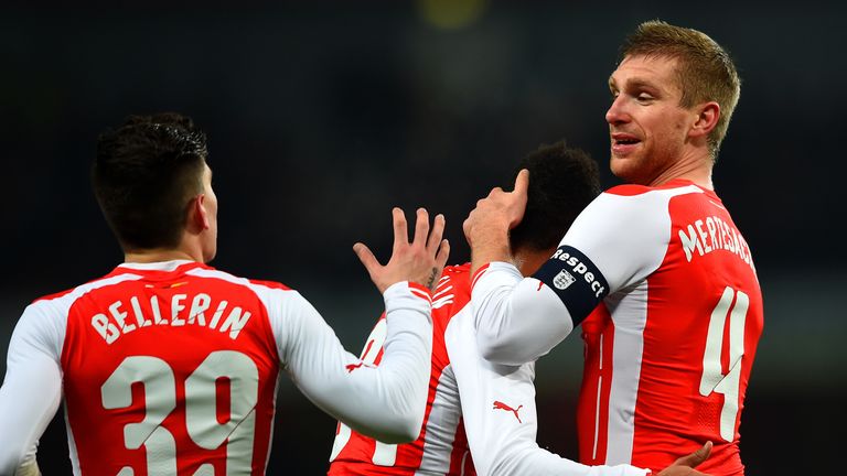 Per Mertesacker of Arsenal celebrates with team-mates after scoring the opening goal during the FA Cup Third Round match v Hull City