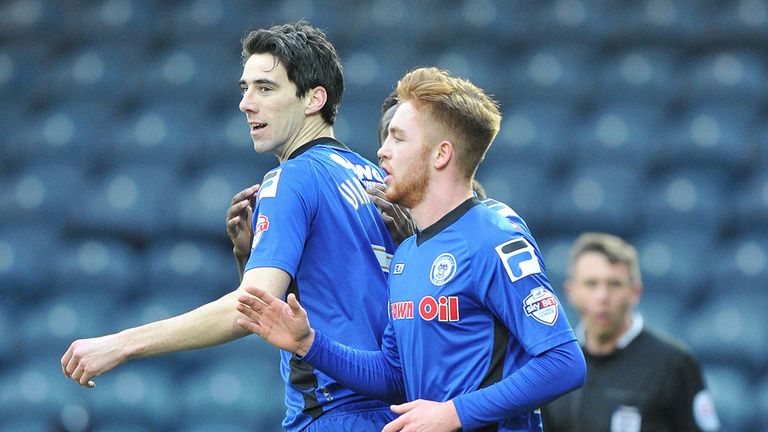 Rochdale's Peter Vincenti is congratulated on scoring his team's opening goal during the FA Cup Third Round match at Spotland, Rochdale.