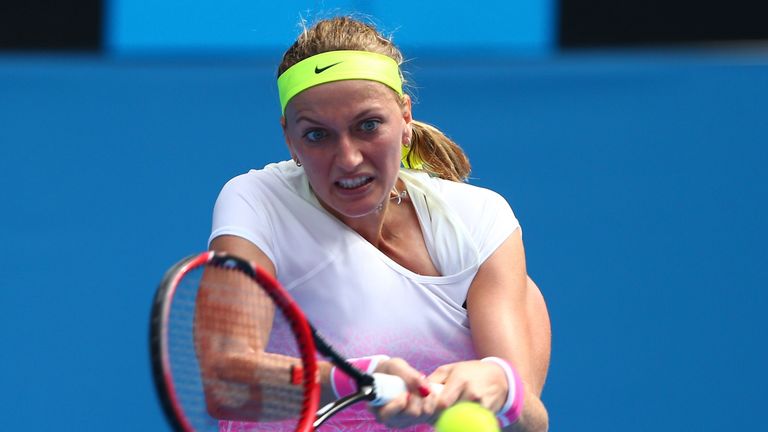 MELBOURNE, AUSTRALIA - JANUARY 20:  Petra Kvitova of the Czech Republic plays a backhand in her first round match against Richel Hogenkamp of the Netherlan