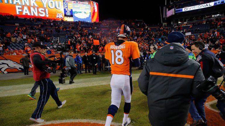 Peyton Manning #18 of the Denver Broncos walks off the field after losing 24-13 to the Indianapolis Colts 