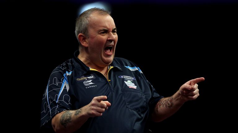 Phil Taylor of England celebrates winning a set during the final of the 2015 William Hill PDC World Darts Championships at A