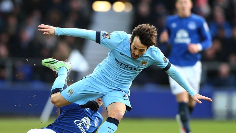 David Silva of Manchester City is brought down during the Barclays Premier League match between Everton and Manchester City