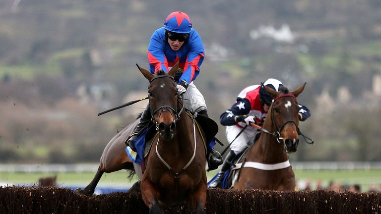 Splash of Ginge ridden by Jamie Bargary on their way to victory in the BetBright Best for Festival Betting Handicap Steeple chase at Cheltenham Racecourse.