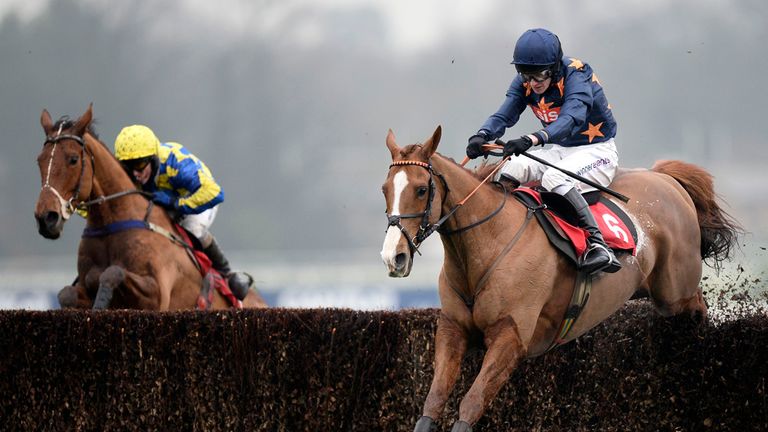 Fairy Rath ridden by jockey Tom Cannon (right) jumps the last ahead of Granville Island ridden by Peter Carberry to go on and win the 32Red Handicap Chase.