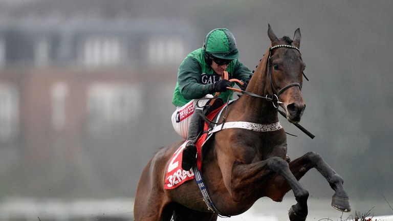 L'Ami Serge ridden by jockey Barry Geraghty jumps the last to go on and win the 32Red Tolworth Hurdle at Sandown.