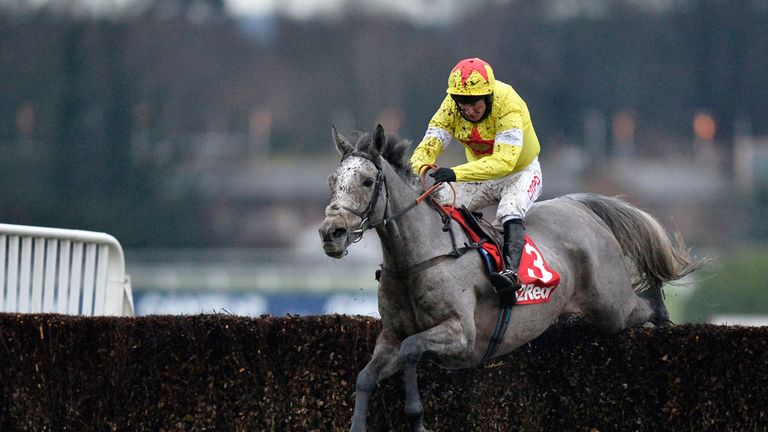 Unioniste ridden by jockey Noel Fehily jumps the last to go on and win the 32Red Casino Handicap Chase at Sandown Park Racecourse, Surrey.