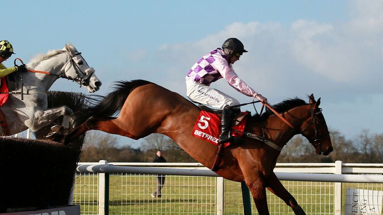 Sego Success ridden by Tom Cannon jumps the last on their way to victory in the Betfred Mobile Hampton Novices´ Chase on Betfred Classic Chase Day at