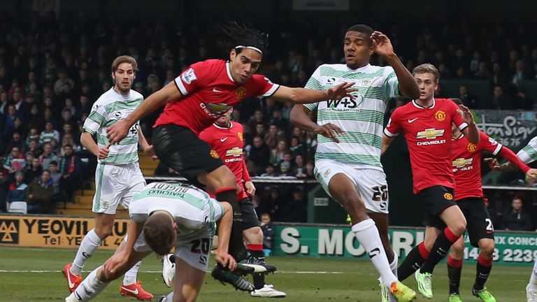 Radamel Falcao of Manchester United in action with Ben Nugent and Stephen Arthurworrey of Yeovil Town during the FA Cup Third Round match
