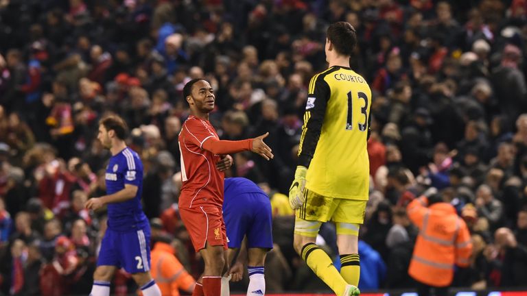 Liverpool's English midfielder Raheem Sterling (L) shakes hands with Chelsea's Belgian goalkeeper Thibaut Courtois (R)