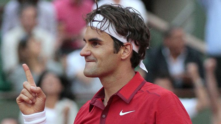 Switzerland's Roger Federer reacts after winning over Serbia's Novak Djokovic during a semi final at the French Open in 2011