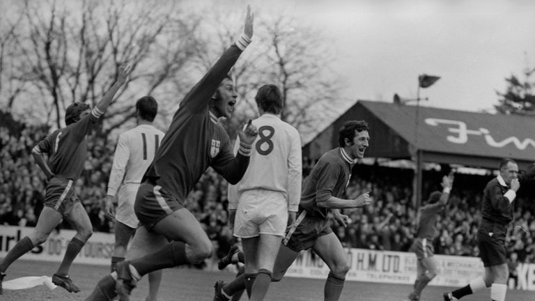Colchester United's Ray Crawford raising his arm in jubilation after scoring his team's first goal against Leeds United in the 1971 FA Cup fifth round