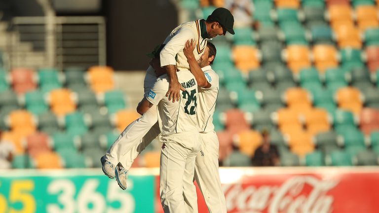 HOBART, AUSTRALIA - MARCH 26:  Ricky Ponting of the Tigers is picked up by teammates James Faulkner and Ben Hilfenhaus in celebration of victory in the She