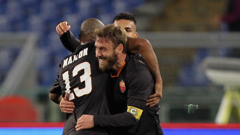 Daniele De Rossi of AS Roma celebrates with his team-mate Maicon after scoring their second goal from penalty spot during the TI