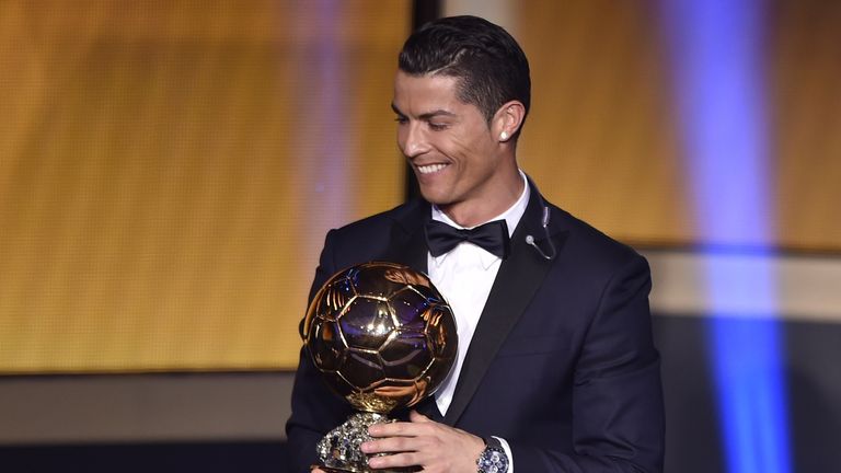 Real Madrid and Portugal forward Cristiano Ronaldo smiles after receiving the  2014 FIFA Ballon d'Or award for player of the year 