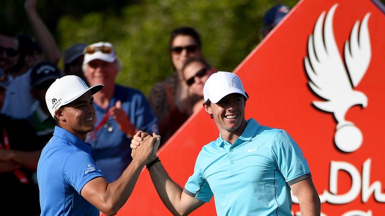 Rickie Fowler congratulates playing partner Rory McIlroy after the Northern Irishman's hole-in-one. 
