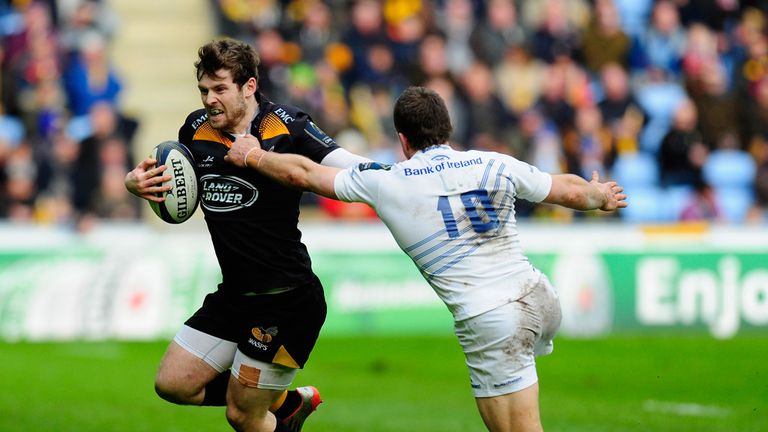 Wasps centre Elliott Daly is tackled by Leinster player Jimmy Gopperth during the  European Rugby Champions Cup match