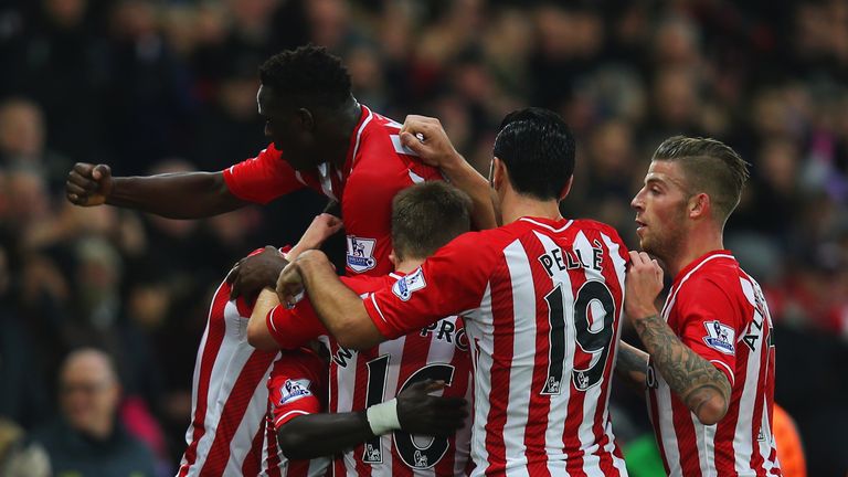 Sadio Mane is mobbed by his Southampton team mates after scoring the opening goal against Arsenal.