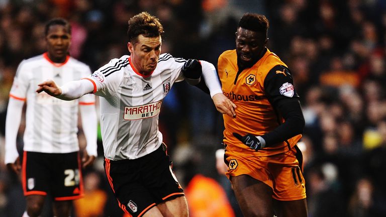 Scott Parker of Fulham challenges Bakary Sako of Wolverhampton Wanderers