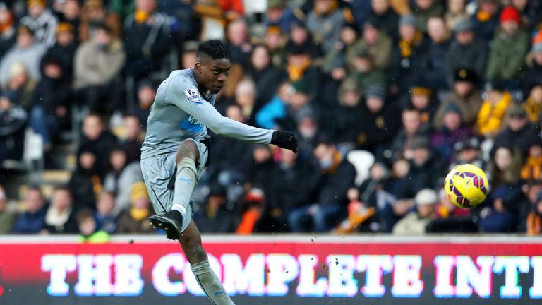 Sammy Ameobi of Newcastle United scores his team's second goal during the Barclays Premier League match between Hull City and N
