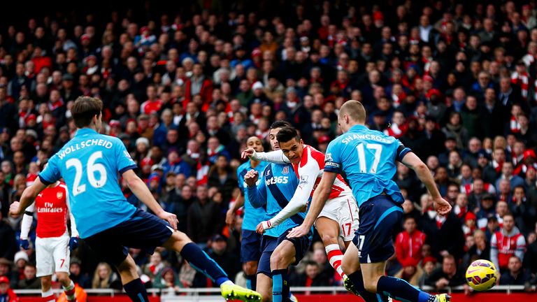 Alexis Sanchez scores his team's second goal.