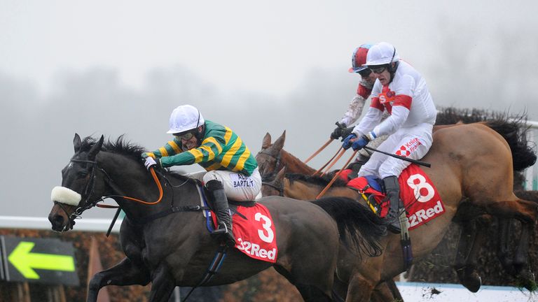ESHER, ENGLAND - JANUARY 03:  Tony McCoy riding Mr Mole clear the last to win The 32RedSport.com Handicap Steeple Chase at Sandown racecourse on January 03