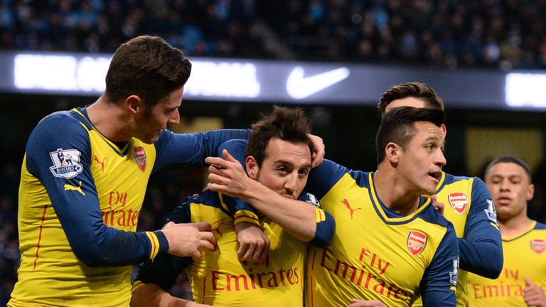 Santi Cazorla celebrates after scoring against Manchester City