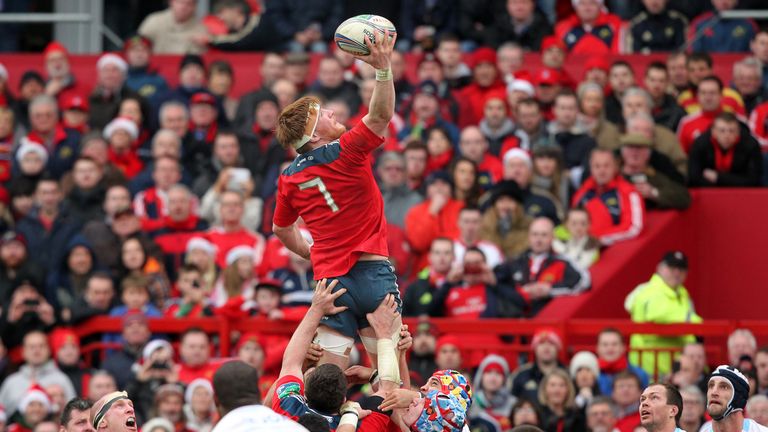 Munster's Sean Dougall (C) wins a line out