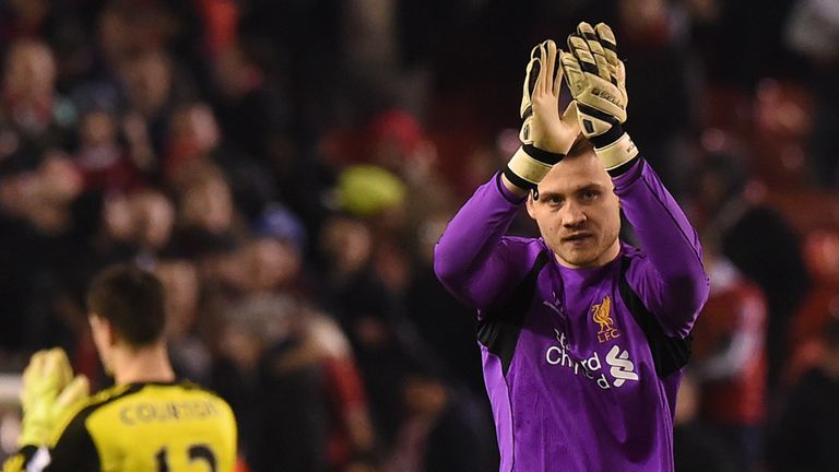 Liverpool's Belgian goalkeeper Simon Mignolet (R) applauds the crowd after the final whistle of the English 