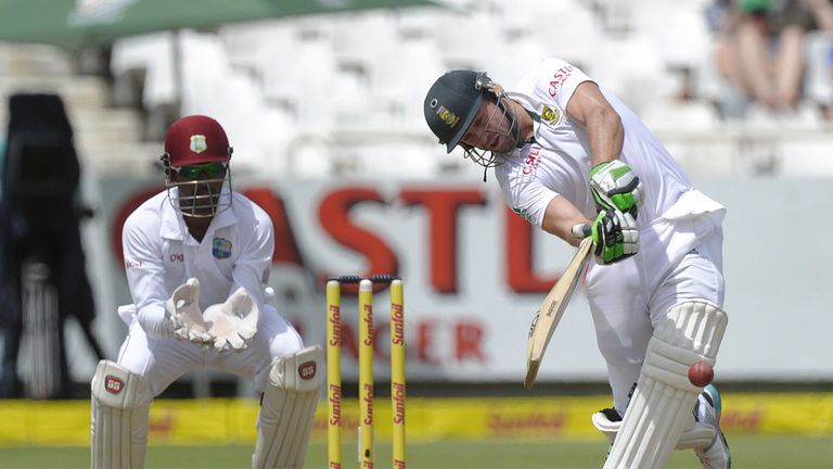 South African batsman AB de Villiers (R) plays a shot during the 3rd day of the third test match between South Africa and the West Indies at Newlands
